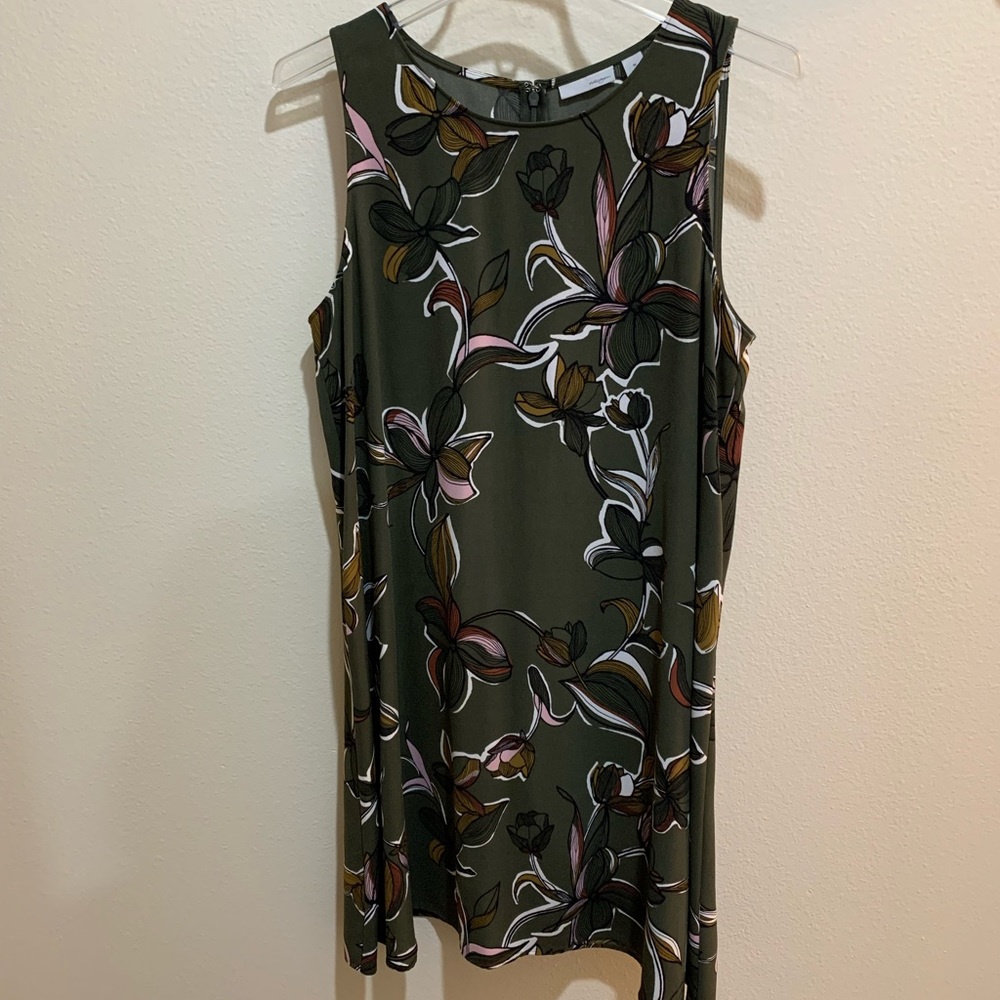 Flowing dress, moss green floral design with zipper back. Worn once.